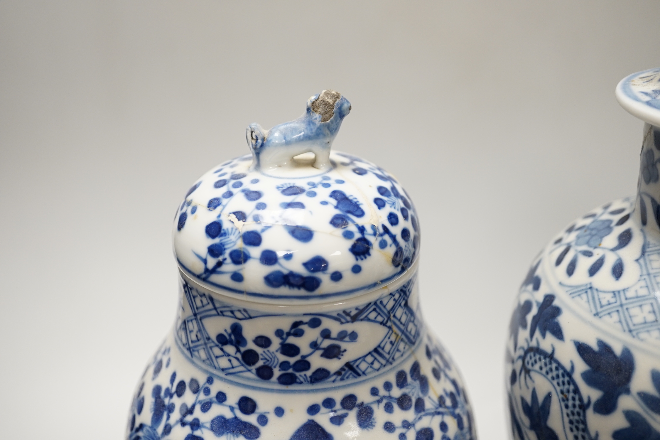 A Chinese blue and white ‘dragon’ vase and cover, and another, tallest 32cm; some damage